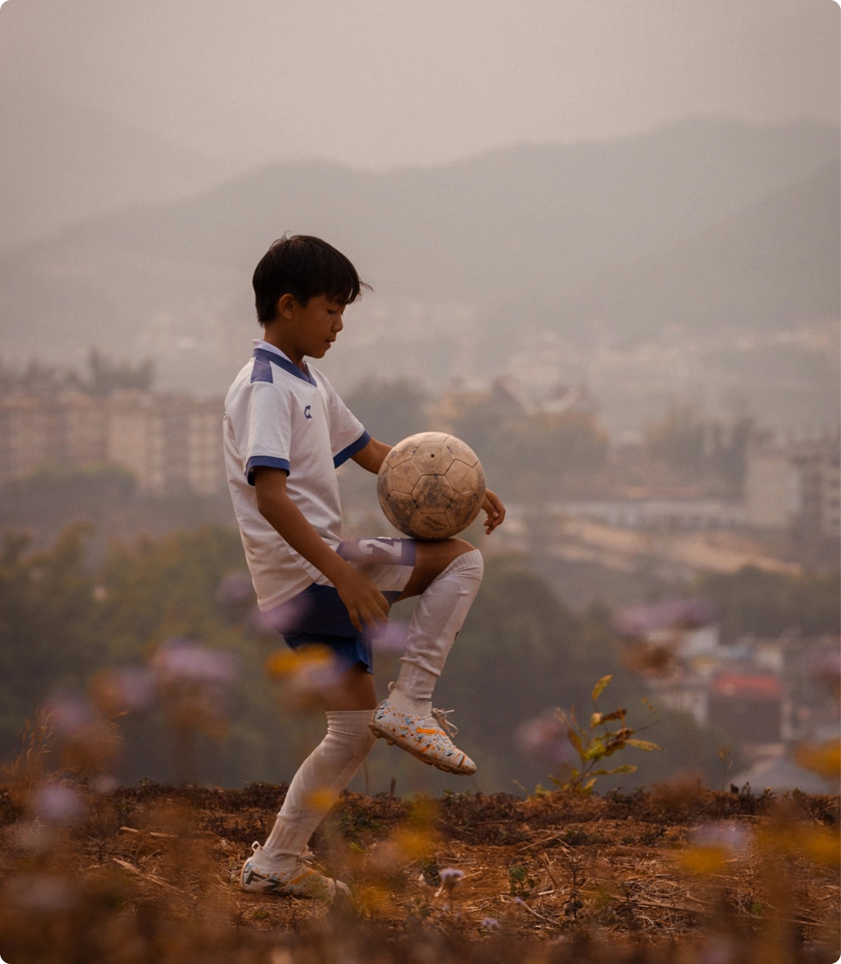 Li Dongmei trains above the mountain town.
